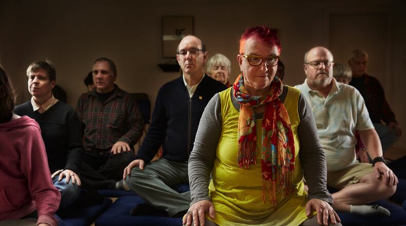 Sue Lesser, front right, joins others in a Sunday morning open meditation at the Shambhala Meditation Center in the Madison Valley neighborhood of Seattle. (Benjamin Benschneider/Seattle Times/TNS)