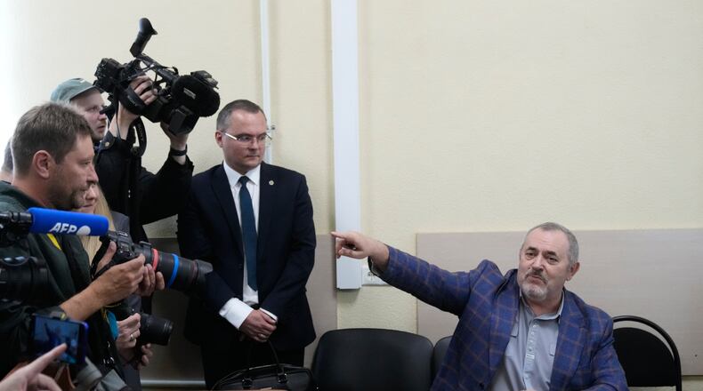 Russian politician Boris Nadezhdin, right, accused of displaying "extremist symbols," gestures speaking at the courtroom in the town of Dolgoprudny outside Moscow, Russia, Friday, July 17, 2026. (AP Photo/Pavel Bednyakov)
