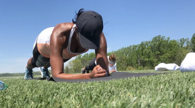 The former first lady performs the perfect plank during a bootcamp she hosted with friends.