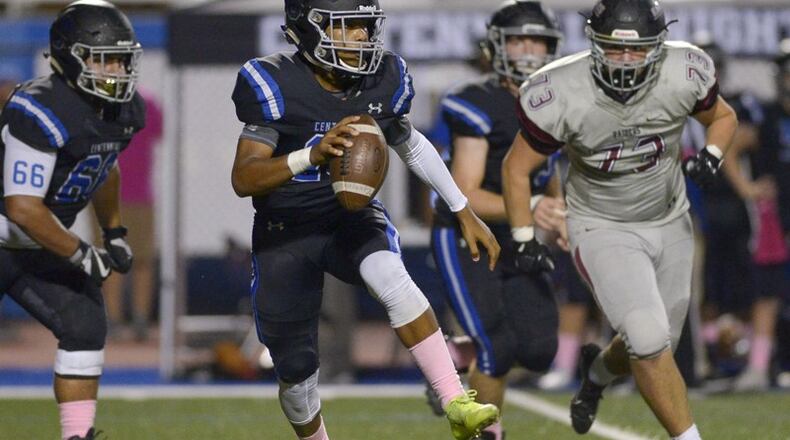 Centennial quarterback Zaire Goff (10) scrambles to avoid Alpharetta's defense in the first half of Friday's game at Centennial. (Daniel Varnado/Special)
