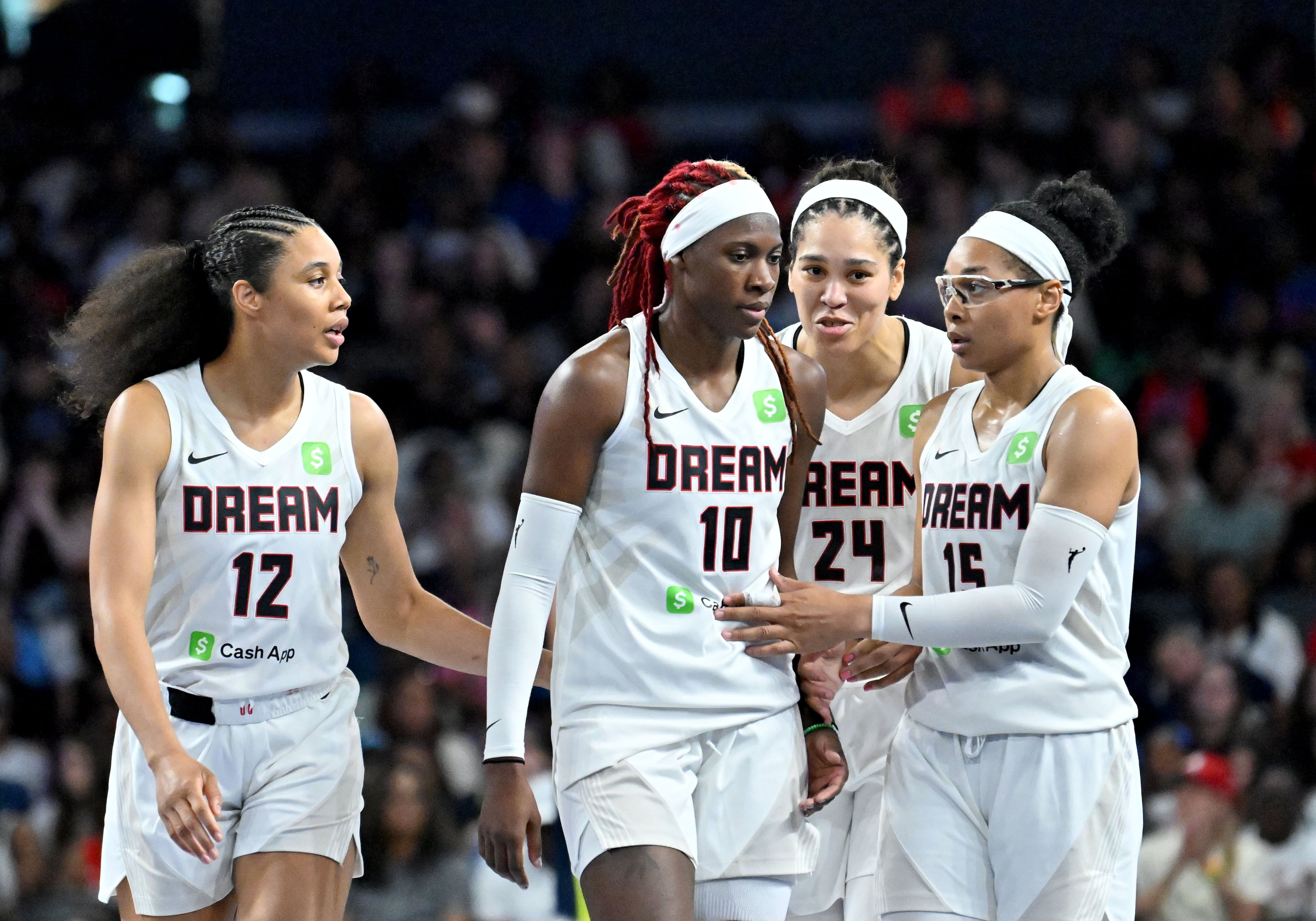 Dream guard Rhyne Howard (10) is celebrated by teammates during the second half against the Dallas Wings at Gateway Center Arena on May 24 in Atlanta. The Dream won 83-75. (Hyosub Shin/AJC)