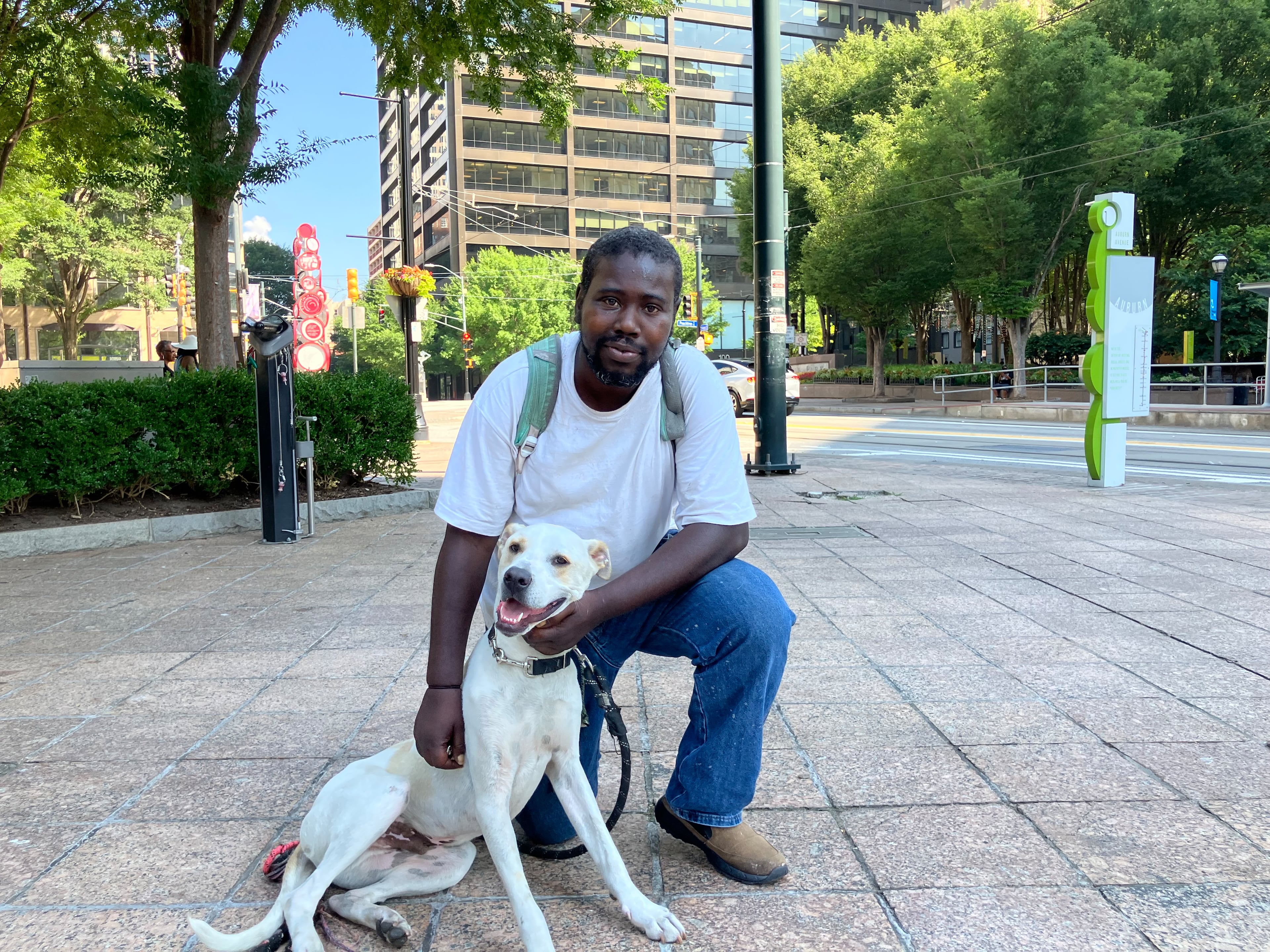 Robert DiBari said he and his dog, Snoop, sleep outside near Woodruff Park in downtown Atlanta. DiBari said has been homeless for over a year. (Reed Williams/AJC)