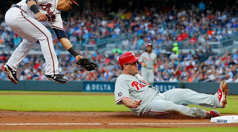 Braves rookie third baseman Rio Ruiz attempts to make a tag on the Phillies’ Maikel Franco in a June game at SunTrust Park. (Photo by Kevin C. Cox/Getty Images)