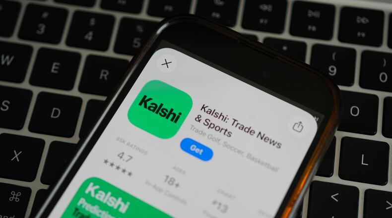 FILE - An ad for the prediction market app Kalshi is displayed on a mobile phone Thursday, April 16, 2026, in Chicago. (AP Photo/Erin Hooley,File)