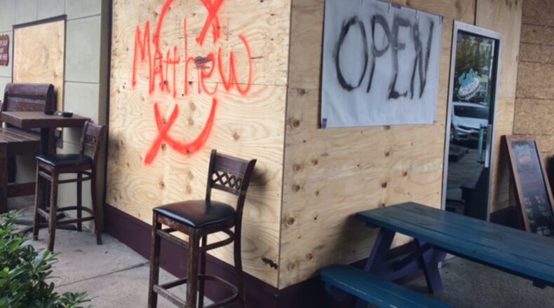 The restaurant Tipsy McSways in downtown Brunswick is boarded up on Wednesday, Oct. 5, 2016 in preparation for Hurricane Matthew. (Christian Boone / cboone@ajc.com)