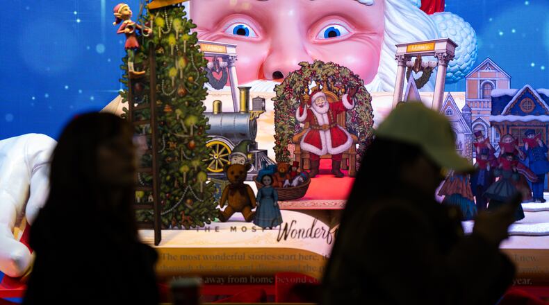 Black Friday Shoppers queue to enter Macy's flagship store in New York on Friday, Nov. 28, 2025. (AP Photo/Angelina Katsanis)