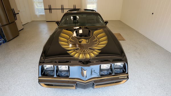 The newly restored 1979 Pontiac Trans-Am is spotted parked at musician Joe Gransden’s home garage July 2, 2024. (Miguel Martinez/AJC)