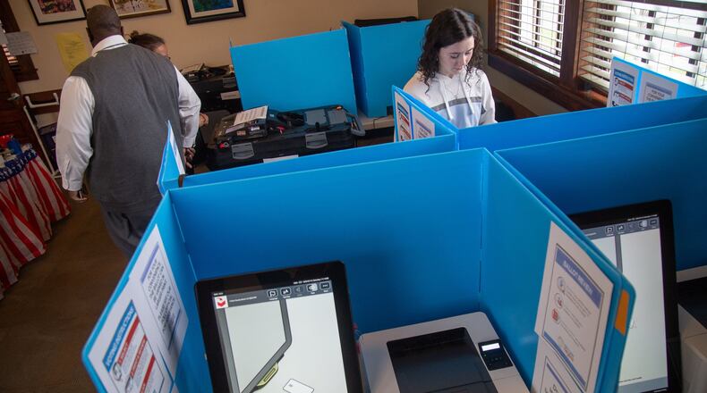 Morgan Jones cast a vote for the first time during a presidential election during Saturday’s early voting at Johns Creek. STEVE SCHAEFER / SPECIAL TO THE AJC