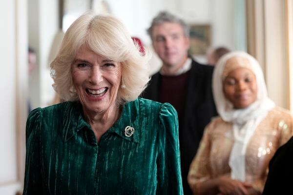 FILE - Britain's Queen Camilla arrives with invited children supported by Helen & Douglas House and Roald Dahl's Marvellous Children's Charity to decorate the Christmas tree and receive a few festive surprises at Clarence House in London, Wednesday, Dec. 6, 2023. (AP Photo/Kin Cheung, Pool, File)
