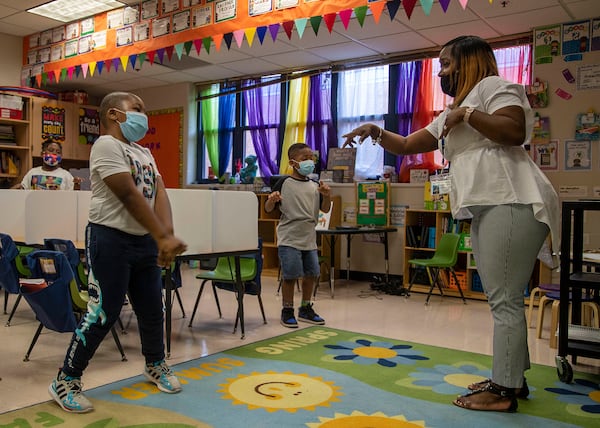 Cascade Elementary School Kindergarten teacher Shiron Jelks participates in a sing along lesson with her students during the Atlanta Public Schools' Summer Academic Recovery Academy at Cascade Elementary School in Atlanta on Wednesday, June 2, 2021.  (Alyssa Pointer / Alyssa.Pointer@ajc.com)