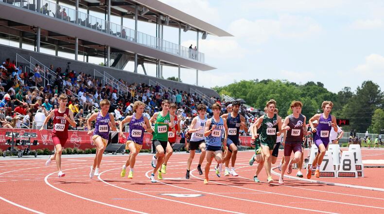Runners compete in the Class 4A boys 1,600-meter run during the GHSA track and field state championships at the UGA Spec Towns Track on Monday, May 11, 2026, in Athens. (Miguel Martinez/AJC)