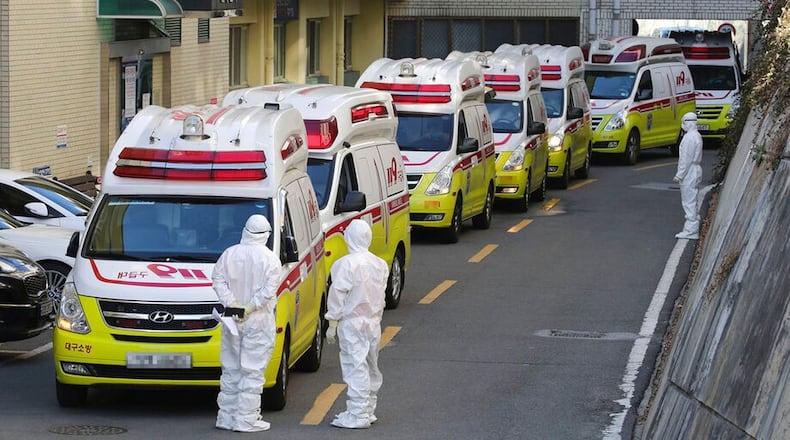 Ambulances carrying patients infected with the novel coronavirus arrive at a hospital in Daegu, South Korea.