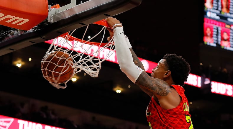 John Collins of the Atlanta Hawks dunks against the Toronto Raptors at State Farm Arena on November 21, 2018 in Atlanta, Georgia.