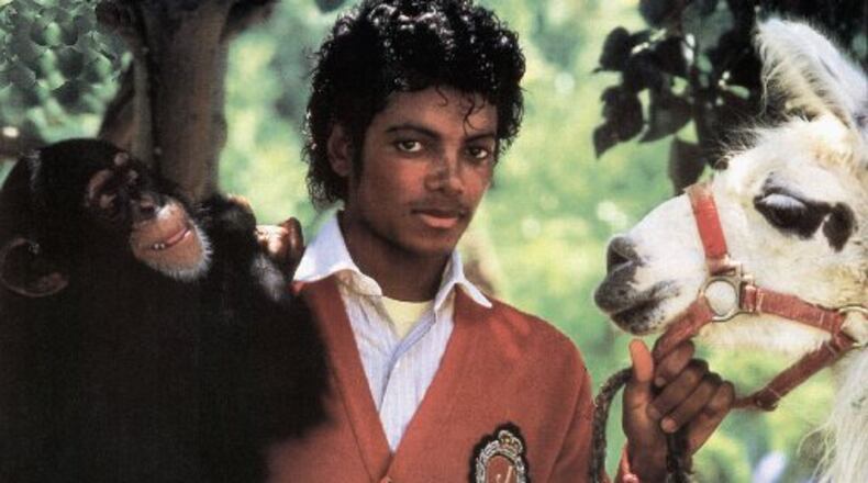 Michael Jackson with Bubbles and a pet llama in 1984. Photo by GAB Archive/Redferns