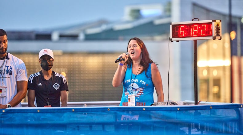 Rachel Norman performs the national anthem ahead of the 2022 Peachtree Road Race.