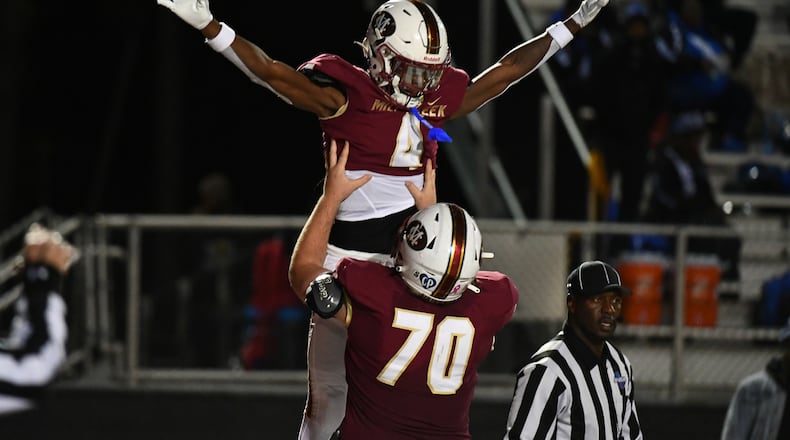 Makhail Wood, wide receiver for Mill Creek, celebrates a touchdown during the Westlake vs. Mill Creek High School Football game on Friday, Nov. 25, 2022, at Mill Creek High School in Hoschton, Georgia. (Jamie Spaar for the Atlanta Journal Constitution)