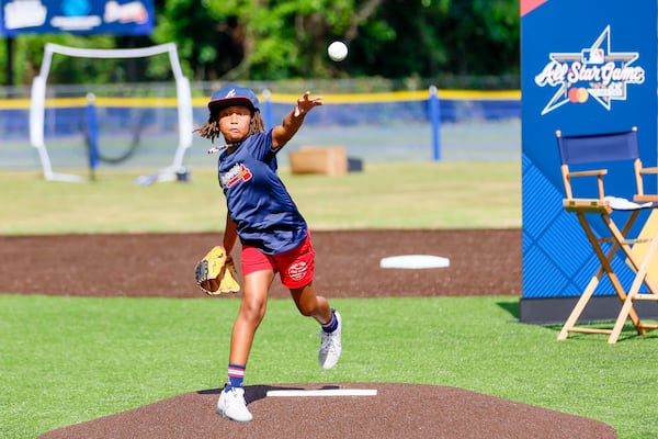 Seven-year-old Zahra Rucker throws the inaugural pitch at Conyers' freshly refurbished field.