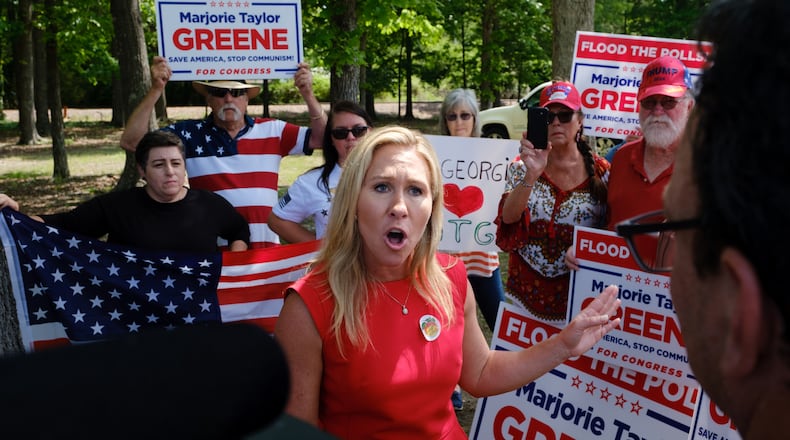 U.S. Rep. Marjorie Taylor Greene speaks to media while campaigning in Rome on Monday, May 2, 2022. (Arvin Temkar / arvin.temkar@ajc.com)