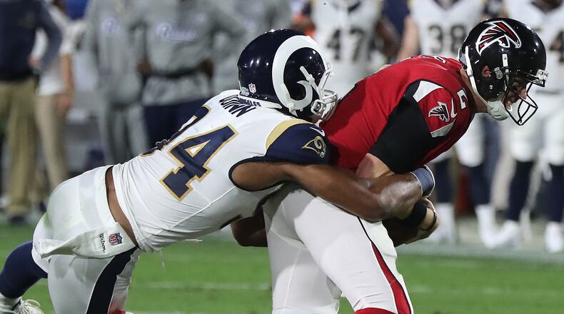 January 6, 2018 Los Angeles: Rams Robert Quinn tackles Matt Ryan on a quarterback keeper during the first quarter in their NFL Wild Card Game on Saturday, January 6, 2018, in Los Angeles.    Curtis Compton/ccompton@ajc.com