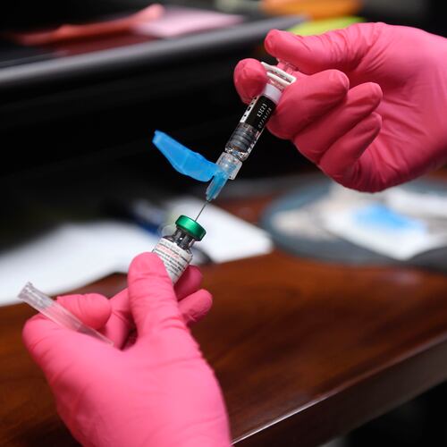 FILE - Anna Hicks prepares a measles, mumps and rubella vaccine at the Andrews County Health Department, Tuesday, April 8, 2025, in Andrews, Texas. (AP Photo/Annie Rice, File)