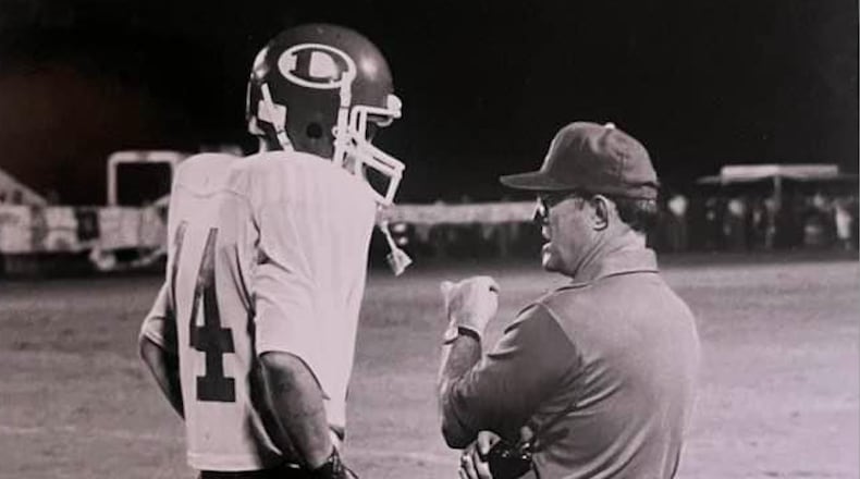 Former longtime Dalton High School football coach (right) speaks with a player on the sideline. Chappell died Sunday, Oct. 27, 2024. (Courtesy of Dalton Public Schools)