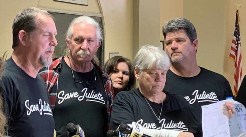 Mike Pless (from left, foreground), Kim Brock, Gloria Hammond and Karl Cass, all residents of Juliette, visited the state Capitol on Monday to connect with lawmakers and ask them to support bills that would require coal ash to be stored in lined landfills at Georgia Power plants across the state. NEDRA RHONE / NEDRA.RHONE@AJC.COM