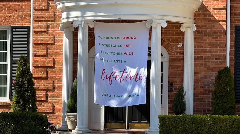 This banner was placed outside the Alpha Chi Omega sorority house at the University of Georgia, where Laken Hope Riley was a member. Riley, 22, was found dead in a wooded area on the UGA campus last Thursday. Riley attended UGA and transferred to the Augusta University nursing program in Athens. (Fletcher Page / fletcher.page@ajc.com)