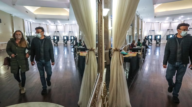 January 5, 2021 Atlanta: Voters exit after casting their ballots on Tuesday, Jan. 5, 2021 at the Park Tavern located at 500 10th St NE in Atlanta. Georgia’s long moment in the national spotlight culminated Tuesday, Jan. 5, 2021, when state voters cast their votes to determine which party would control the U.S. Senate. Georgia voters also voted to elect a member of the state Public Service Commission, which regulates energy and utility rates and issues. The two most expensive Senate races in history saw more than $833 million been spent by the four campaigns and outside groups supporting them, blanketing the airwaves and stuffing mailboxes across the state. Much of that money has come from organizations with no direct connection to Georgia. (John Spink / John.Spink@ajc.com)