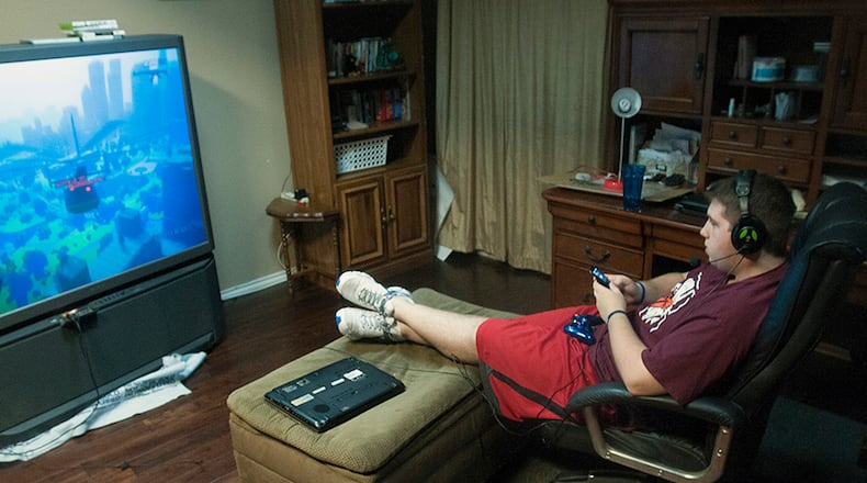 A survey finds male teenagers spent an average of 56 minutes a day gaming, while girls devoted only seven minutes. Rex C. Curry/Dallas Morning News/MCT