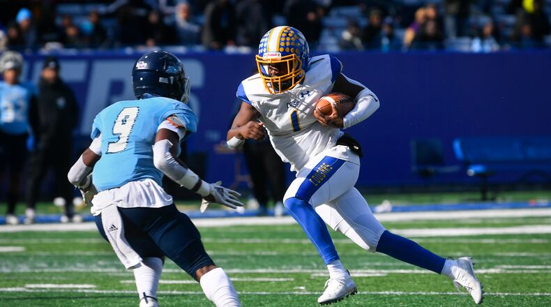 Crisp County QB AJ Lofton runs as Cedar Grove Safety Jordan Greer (9) defends during the AAA state title football game on Saturday Dec.14, 2019. John Amis / Special