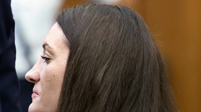 Lindsay Clancy grins after her attorney Kevin Reddington concluded his cross examination of rebuttal witness Dr. Avram Mack during her murder trial at Plymouth Superior Court, Monday, Aug. 24, 2026 in Plymouth, Mass. (Greg Derr/The Patriot Ledger via AP, Pool)