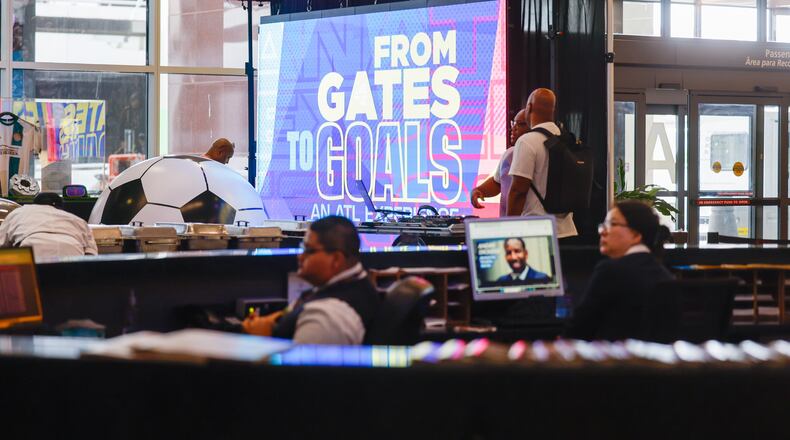 A screen marks the "From Gates to Goals" exhibit celebrating the upcoming FIFA World Cup at Hartsfield-Jackson Atlanta International Airport's international terminal in Atlanta on May 27, 2026. (Arvin Temkar/AJC)