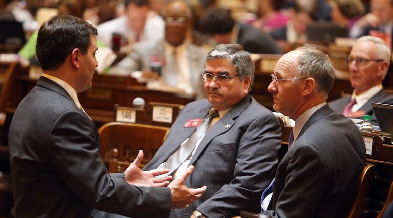 Rep. Richard Smith, R-Columbus, chairman of the House Insurance Committee, shown here center, in 2014. Smith’s measure on “surprise billing,” HB 71, was tabled by the House Friday, March 3, 2017, but that leaves room for a Senate bill on the issue to advance. Backers suspect it to see action in the committee led by Smith. Photo by BEN GRAY / AJC.