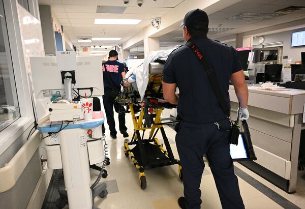 EMS crew bring a patient in the Emergency and Trauma Center at Northeast Georgia Medical Center (NGMC) in Gainesville on Jan. 20, 2021.  A January survey by Morning Consult found that 26% of U.S. health care workers have considered leaving their job since the pandemic. (Hyosub Shin / Hyosub.Shin@ajc.com)