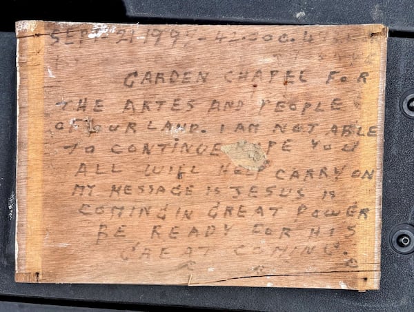 A sign hung on the front door of Howard Finster's World's Folk Art Church telling visitors that he had to close the church. Courtesy of Eddy Willingham