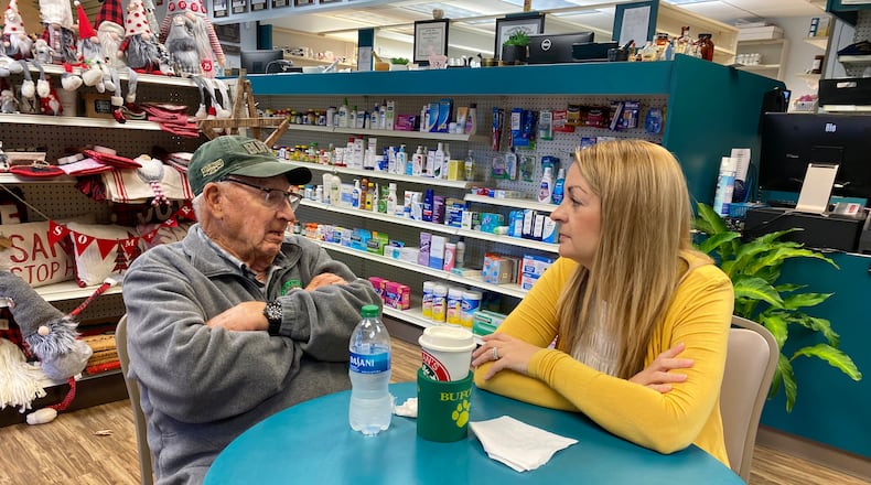 Pharmacist Danica Robertson and friend, Robert Blan, reminisce about the coffee club that has existed at Sherwood's Drug Shop in Buford for decades.
(Keri Janton for The Atlanta Journal-Constitution)