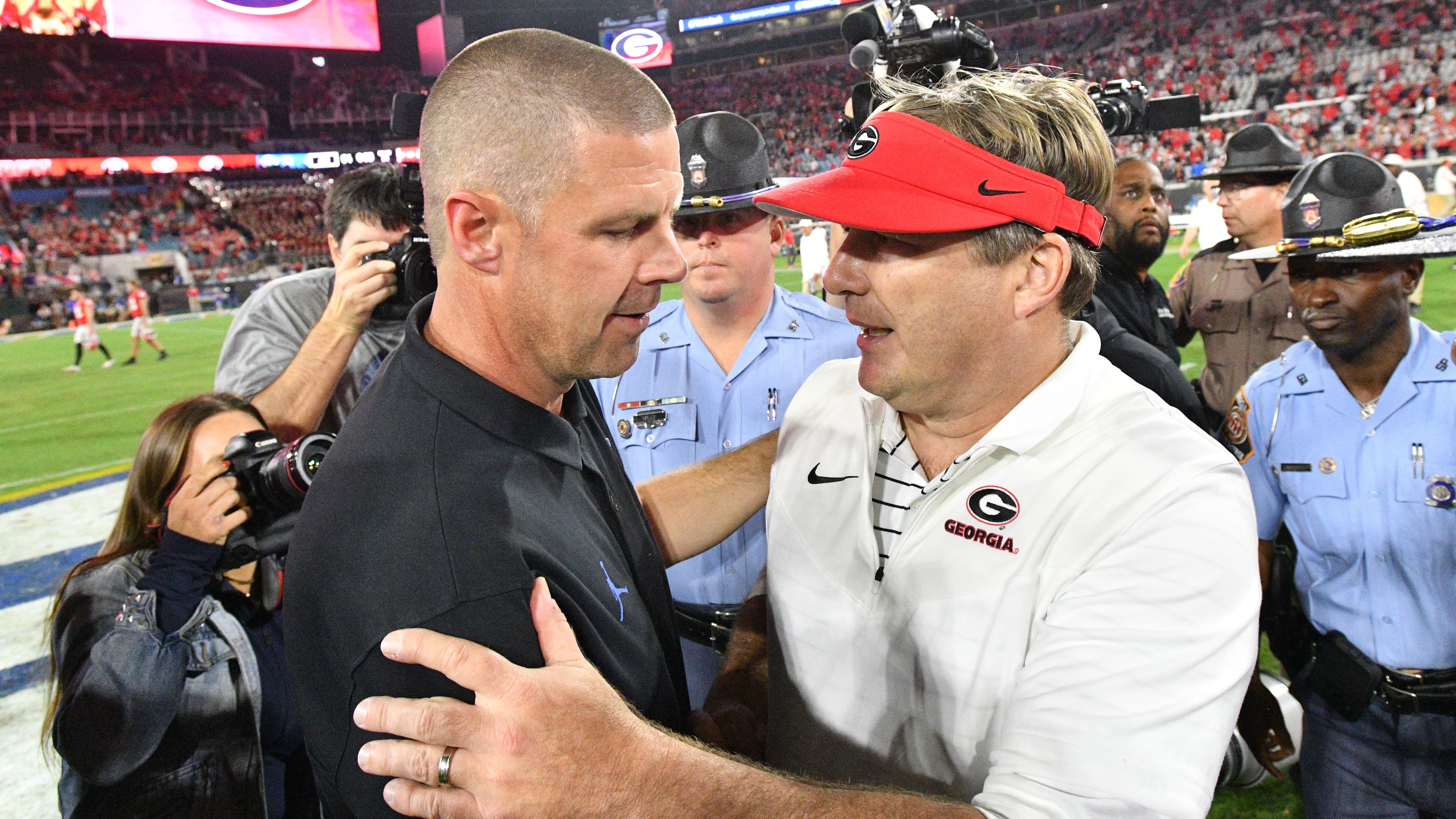 Billy Napier, left, and Georgia's head coach Kirby Smart shake hands after Georgia beat Florida in an NCAA college football game at TIAA Bank Field in Jacksonville, Florida on Saturday, October 29, 2022. Napier has been ousted as Florida's head coach. (Hyosub Shin/AJC 2022)