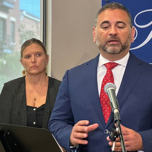 Tad Thomas, a lawyer for the family of Henry Willis, right, speaks at a news conference while Willis' mother, Laura Herp, looks on Thursday, July 16, 2026, in Louisville, Ky. (AP Photo/Dylan Lovan)