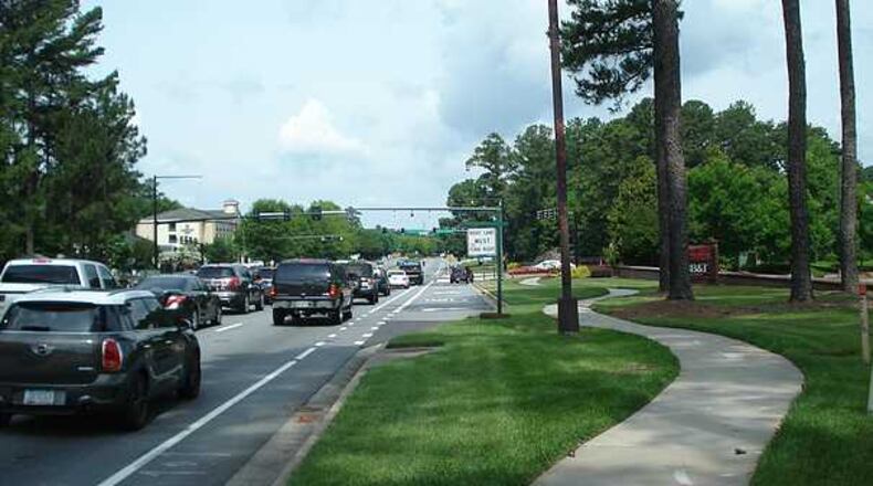 The North Fulton CID is breaking ground on a $620,000 road project near Windward Parkway at Ga. 400 on Thursday, April 11, 2019.