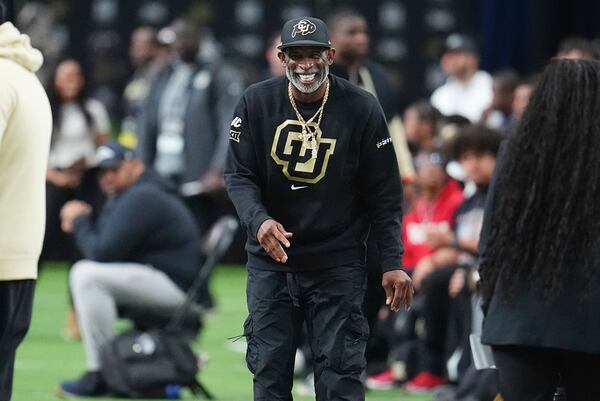 Colorado head coach Deion Sanders looks on as players take part in the 40-yard dash during Colorado's NFL football pro day Friday, April 4, 2025, in Boulder, Colo. (AP Photo/David Zalubowski)