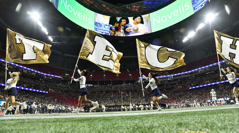 Georgia Tech fans celebrate after quarterback Jeff Sims scored a touchdown during the first half of an NCAA college football game at Mercedes-Benz Stadium in Atlanta on Saturday, September 25, 2021. (Hyosub Shin / Hyosub.Shin@ajc.com)
