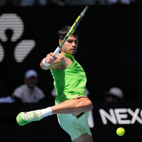 Carlos Alcaraz of Spain kicks the ball during his fourth round match against Tommy Paul of the U.S. at the Australian Open tennis championship in Melbourne, Australia, Sunday, Jan. 25, 2026. (AP Photo/Dita Alangkara)