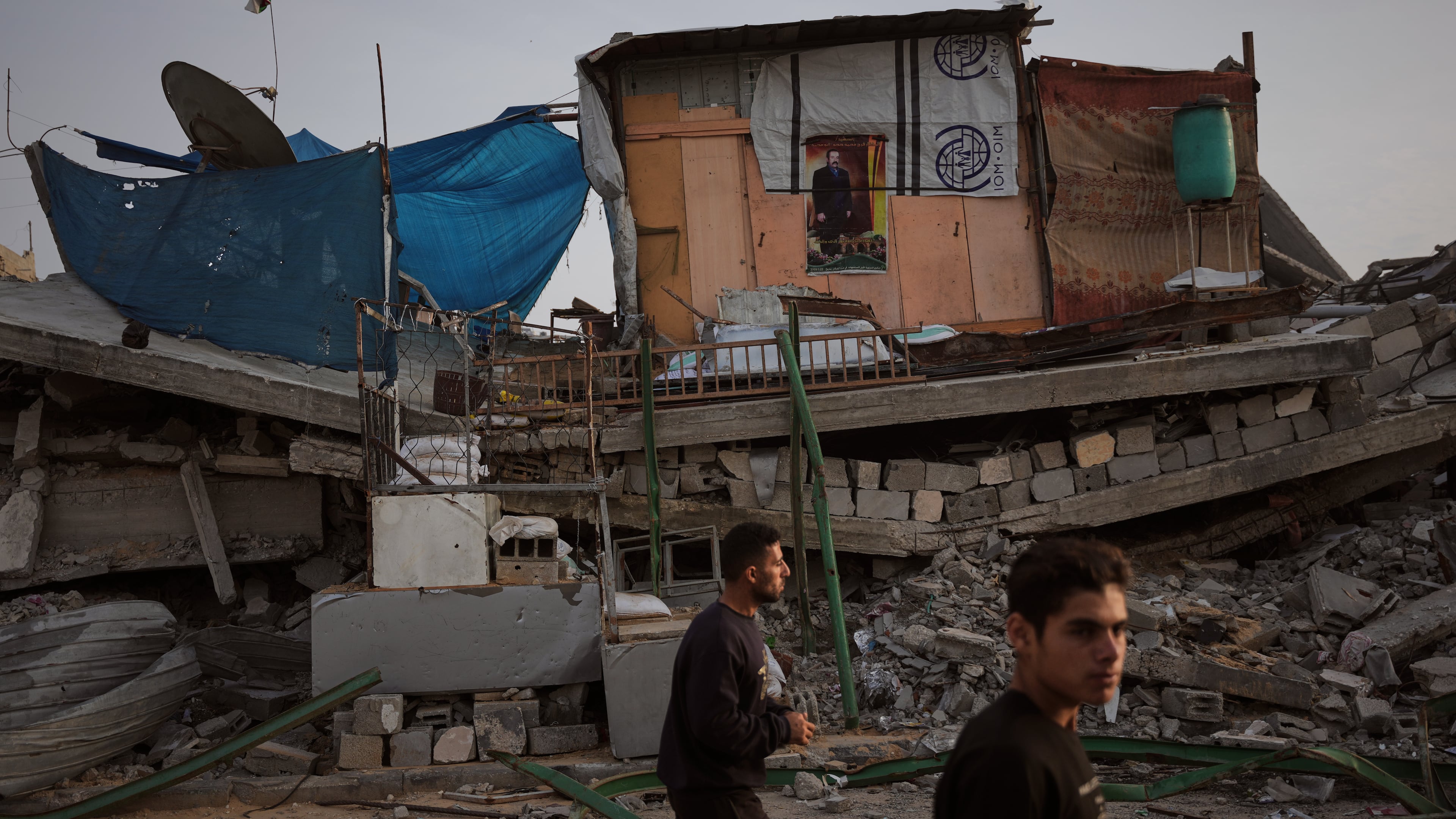 A tent sheltering displaced Palestinians stands atop rubble left by Israeli air and ground operations in Gaza City Saturday, Nov. 29, 2025. (AP Photo/Abdel Kareem Hana)