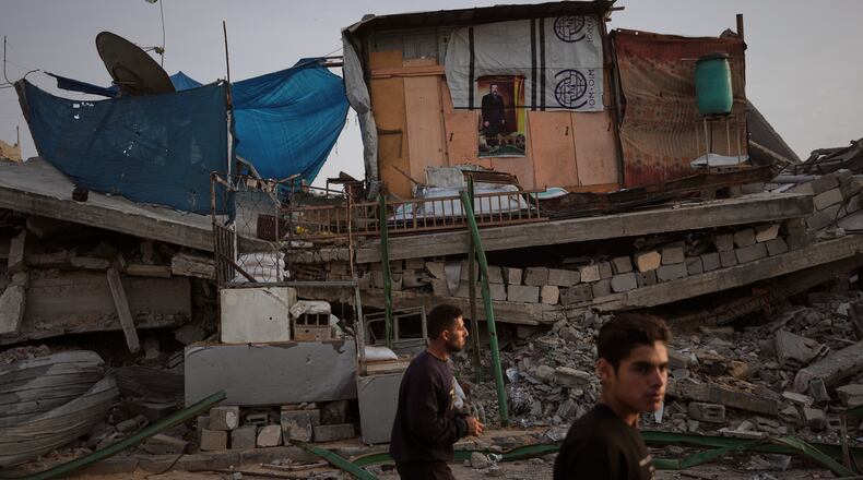 A tent sheltering displaced Palestinians stands atop rubble left by Israeli air and ground operations in Gaza City Saturday, Nov. 29, 2025. (AP Photo/Abdel Kareem Hana)
