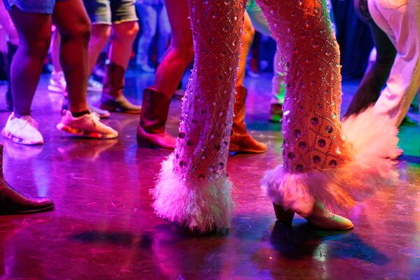 Line dancers participate in a Dolly Parton themed event at the Heretic on Aug. 27, 2026. (Frankie Cole for the AJC)