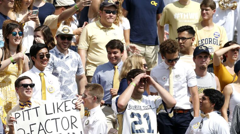 ATLANTA, GA - SEPTEMBER 23:  A Georgia Tech Yellow Jackets fan holds a sign while other fans look on during the game against the Pittsburgh Panthers at Bobby Dodd Stadium on September 23, 2017 in Atlanta, Georgia.  (Photo by Mike Zarrilli/Getty Images)