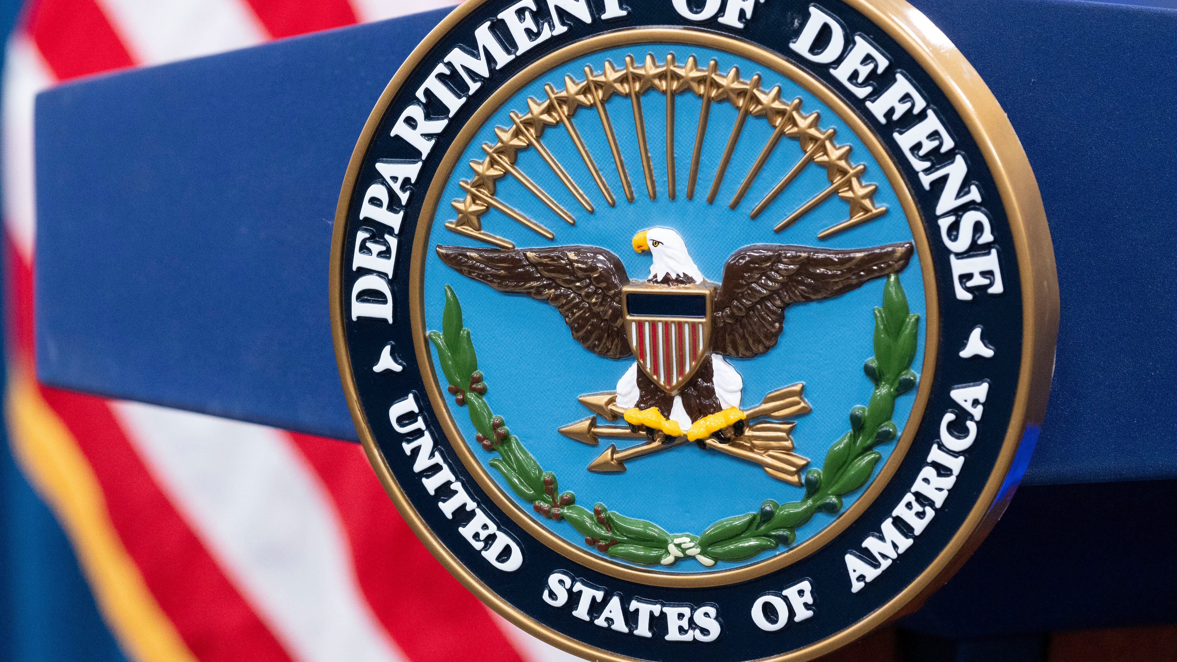 FILE - The Department of Defense seal is seen on the podium in the Press Briefing room at the Pentagon on Oct. 29, 2024, in Washington. (AP Photo/Kevin Wolf, File)