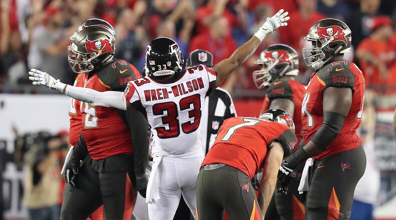 December 18, 2017 Tampa: Buccaneers kicker Patrick Murray drops his head in dejection missing a field goal that would have tied the game as time expires while Falcons cornerback Blidi Wreh-Wilson starts the celebration holding on for a 24-21 victory over the Bucs in a NFL football game on Monday, December 18, 2017, in Tampa. Curtis Compton/ccompton@ajc.com