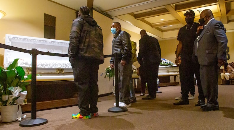 Friends and family come together at the Gregory B. Levett & Sons Funeral Home during the visitation for the DeKalb fire victims Wednesday. (STEVE SCHAEFER FOR THE ATLANTA JOURNAL-CONSTITUTION)