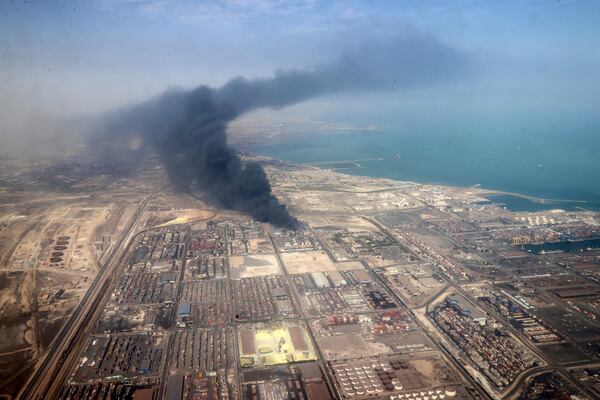 In this photo released by the Iranian Presidency Office, smoke rises in the sky on Sunday, April 27, 2025 after a massive explosion and fire rocked a port near the southern port city of Bandar Abbas, Iran, on Saturday. (Iranian Presidency Office via AP)